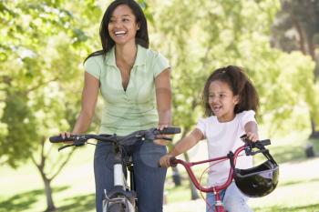 Royalty Free Photo of Two Women on Cycles