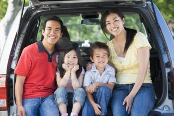Royalty Free Photo of a Family in a Hatchback