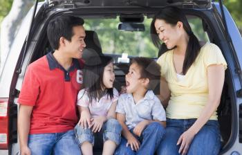Royalty Free Photo of a Family in a Hatchback