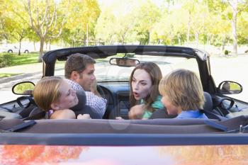 Royalty Free Photo of a Family in a Convertible