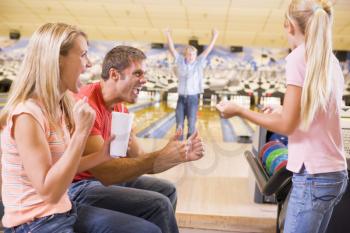 Royalty Free Photo of a Family Bowling