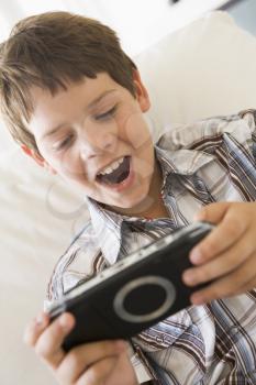 Royalty Free Photo of a Young Boy With a Video Game Controller