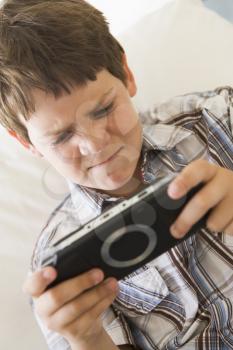 Royalty Free Photo of a Young Boy With a Game Control