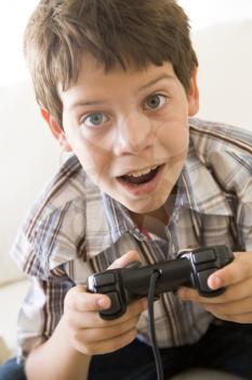 Royalty Free Photo of a Young Boy With a Video Game Controller