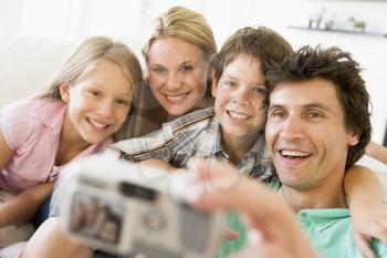 Royalty Free Photo of a Family Taking a Picture