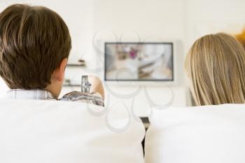 Royalty Free Photo of a Boy and Girl Watching Television