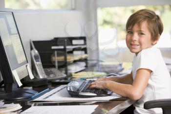 Royalty Free Photo of a Small Child at a Computer
