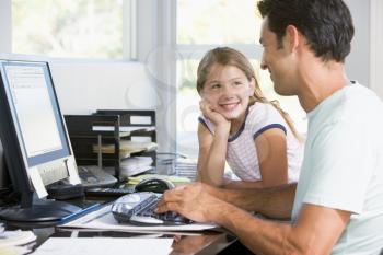 Royalty Free Photo of a Father and Daughter at the Computer