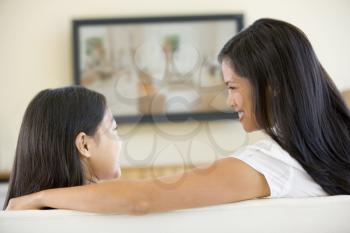 Royalty Free Photo of a Mother and Daughter Watching Television