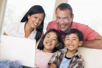 Royalty Free Photo of a Family With a Laptop