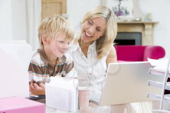 Royalty Free Photo of a Woman With Her Son at a Laptop