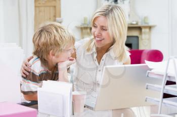 Royalty Free Photo of a Woman and Her Son at a Laptop