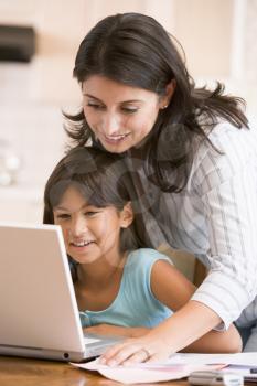 Royalty Free Photo of a Woman and Girl at a Laptop