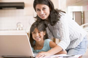 Royalty Free Photo of a Woman and a Girl at a Laptop