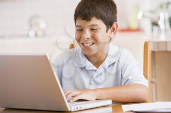 Royalty Free Photo of a Boy With a Laptop