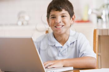 Royalty Free Photo of a Boy at a Laptop