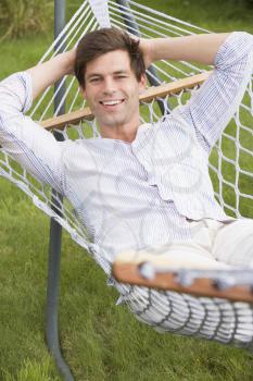 Royalty Free Photo of a Man in a Hammock