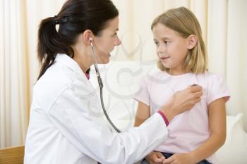 Royalty Free Photo of a Doctor With a Little Girl