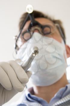 Royalty Free Photo of a Dentist With a Drill