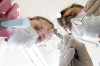 Royalty Free Photo of a Dentist and Assistant