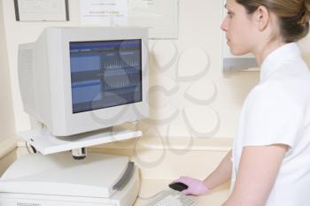 Royalty Free Photo of a Dental Assistant With a Computer