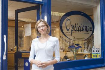Royalty Free Photo of a Woman Outside an Optometrist's Office