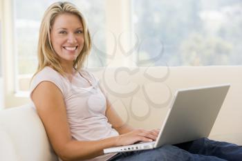 Royalty Free Photo of a Woman at Home With a Laptop