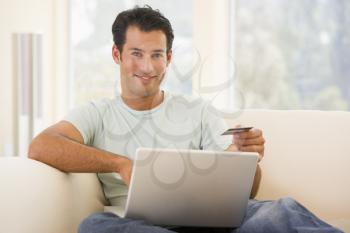Royalty Free Photo of a Man With a Laptop and Credit Card