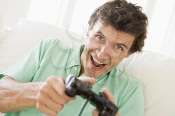 Royalty Free Photo of a Man Playing Video Games