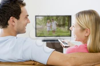 Royalty Free Photo of a Couple Watching TV