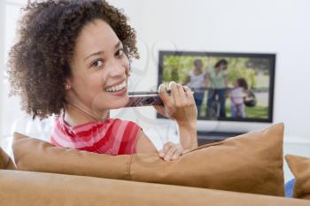 Royalty Free Photo of a Woman Watching Television
