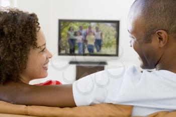Royalty Free Photo of a Couple Watching TV