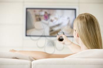 Royalty Free Photo of a Woman Watching Television