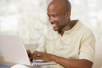 Royalty Free Photo of a Man Using a Laptop
