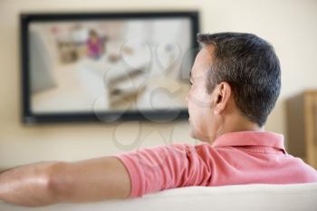 Royalty Free Photo of a Man Watching Television