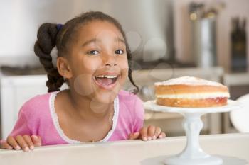 Royalty Free Photo of a Girl With a Cake