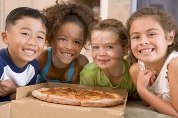 Royalty Free Photo of Four Children With Pizza