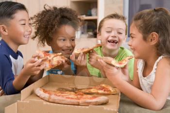 Royalty Free Photo of Children Eating Pizza