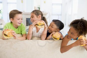 Royalty Free Photo of Children Eating Cheeseburgers
