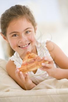 Royalty Free Photo of a Girl Eating Pizza