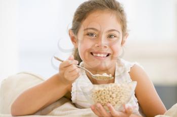 Royalty Free Photo of a Girl Eating Cereal