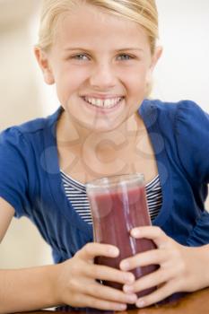 Royalty Free Photo of a Girl Drinking Juice
