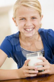 Royalty Free Photo of a Girl Drinking Milk