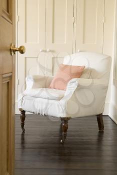 Royalty Free Photo of a Chair in a Bedroom