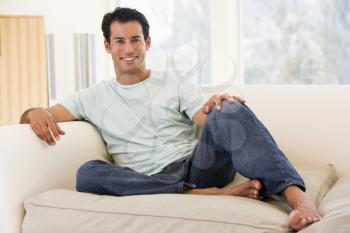 Royalty Free Photo of a Man on a Couch