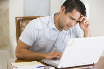 Royalty Free Photo of a Man With a Laptop Looking Stressed