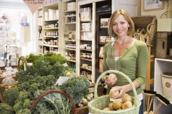 Royalty Free Photo of a Woman Looking at Produce