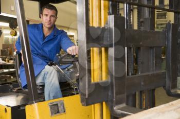 Royalty Free Photo of a Man in a Forklift