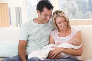 Royalty Free Photo of a Couple With Their Baby