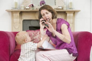Royalty Free Photo of a Mother Talking on the Phone